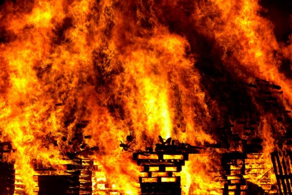 Massive fireworks explosion leaves 1 dead, 4 homes destroyed Intense flames engulf wooden pallets in a breathtaking display of fire and heat.